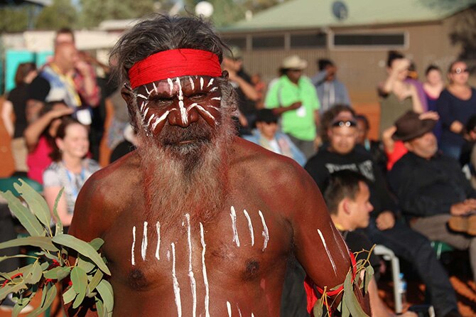 An Indigenous dancer at at the closing ceremony of talks at Uluru. 