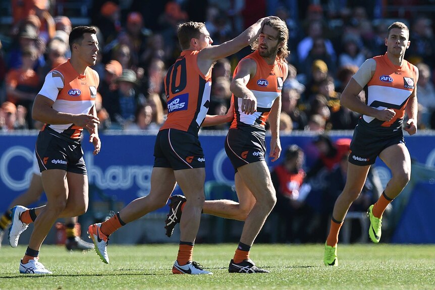 GWS celebrates a Callan Ward goal