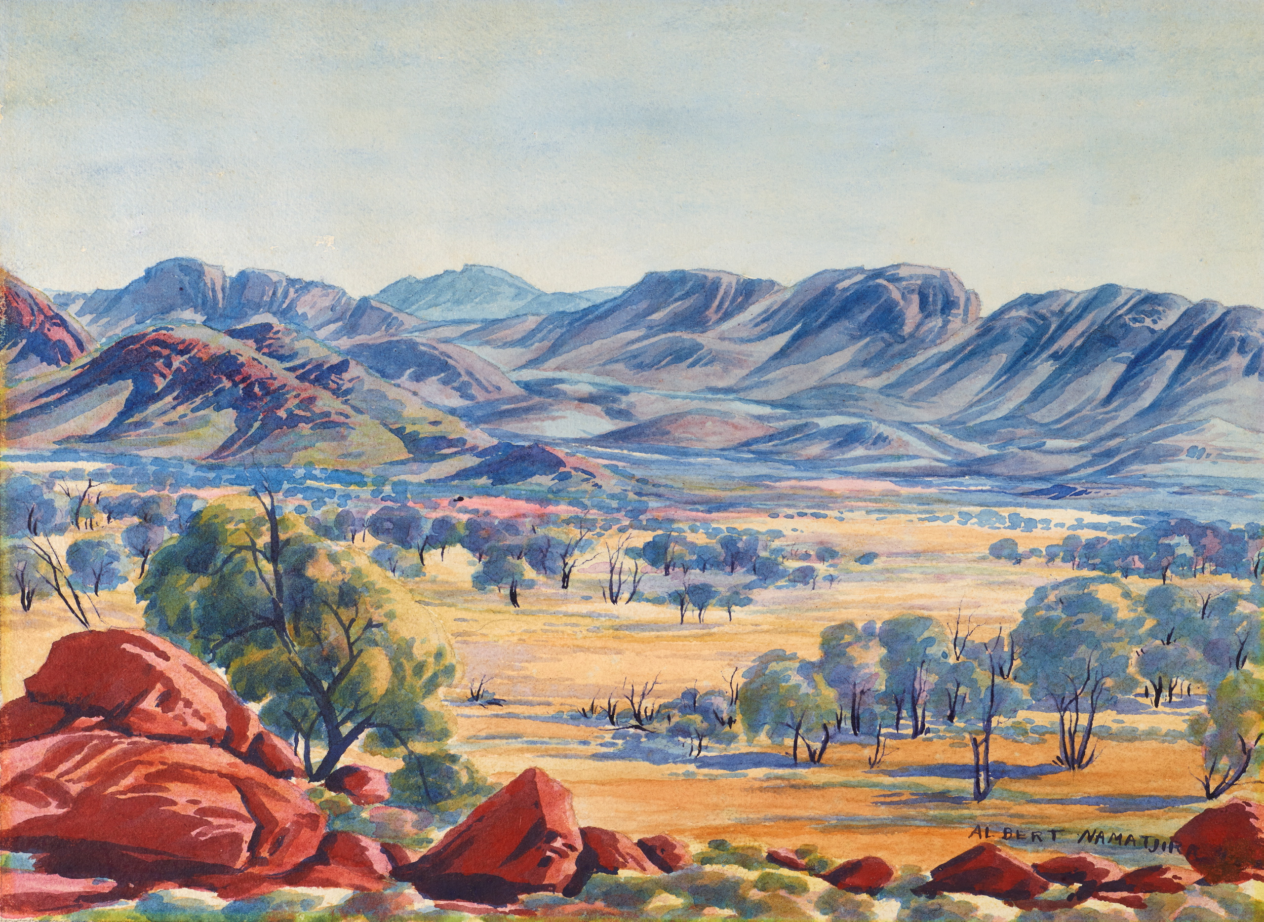 A canvas featuring a mountainous landscape painted in pastel blues and yellow, dotted with green gum trees and red earthy rocks.
