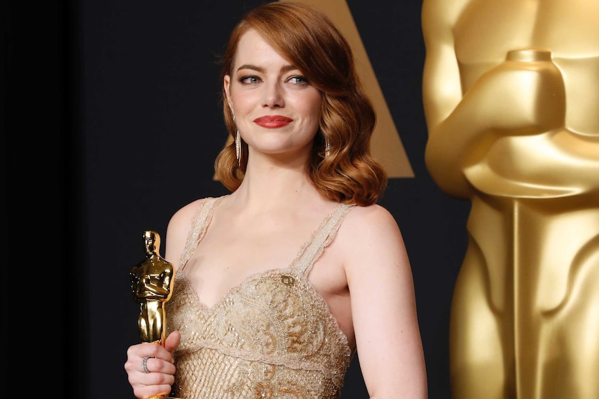 Emma Stone poses with her Oscar for Best Actress for her role in La La Land.