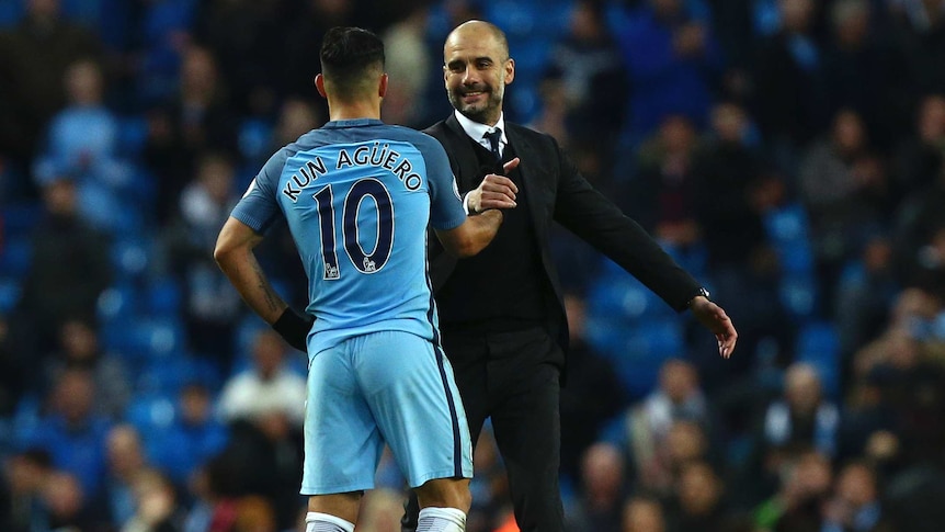 Pep Guardiola (R) shakes hands with Sergio Aguero after the draw with Liverpool.