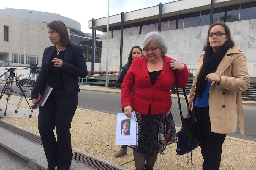Nicholas Sofer Schreiber's family stand outside supreme court