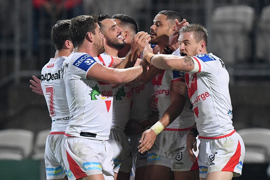 Ben Hunt, Andrew McCullough, Jack Bird, Corey Norman, Brayden Wiliame and Matt Dufty celebrate a Dragons try against the Broncos