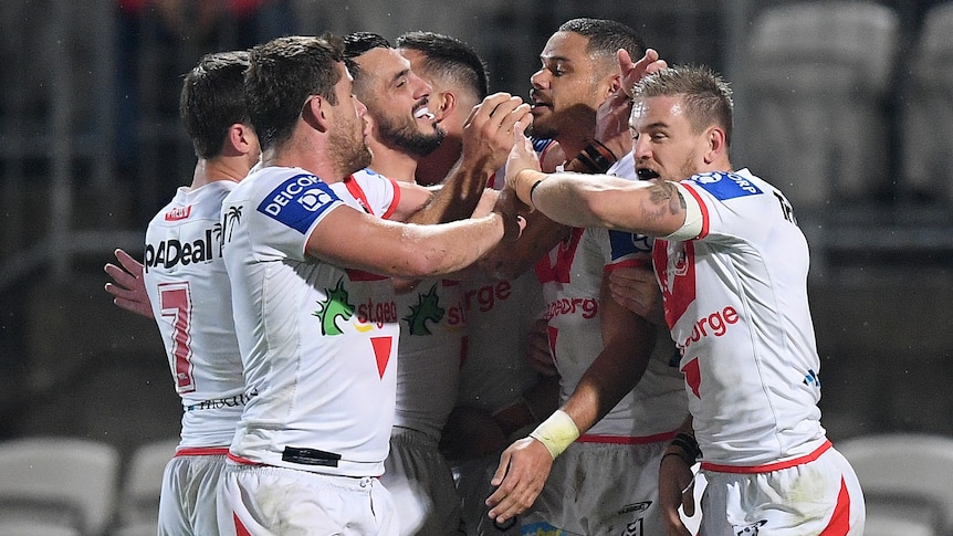 Ben Hunt, Andrew McCullough, Jack Bird, Corey Norman, Brayden Wiliame and Matt Dufty celebrate a Dragons try against the Broncos