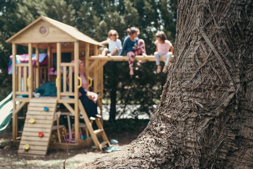 children playing in a cubby house