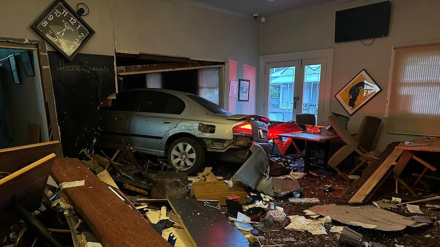 A car inside a crashed pub
