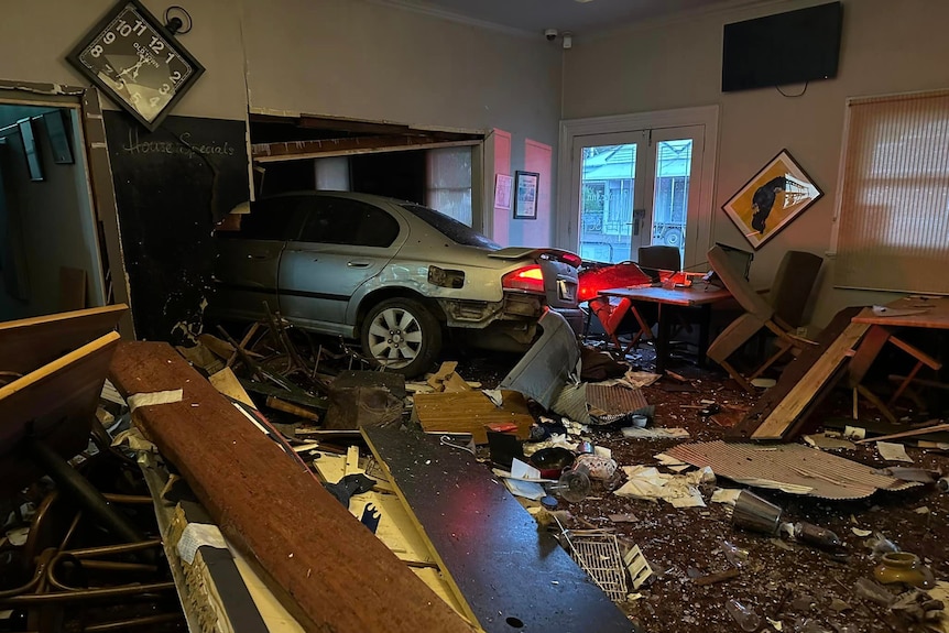 A car inside a crashed pub
