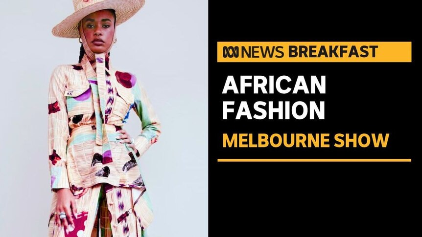 African Fashion. Melbourne Show. Model dressed in hat, matching peplum blazer and skirt with brightly colour print.
