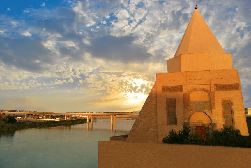 A shrine sits on the edge of a river.