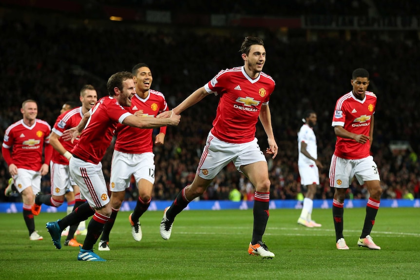 Manchester United's Matteo Darmian (2R) celebrates his goal with team-mates against Crystal Palace.