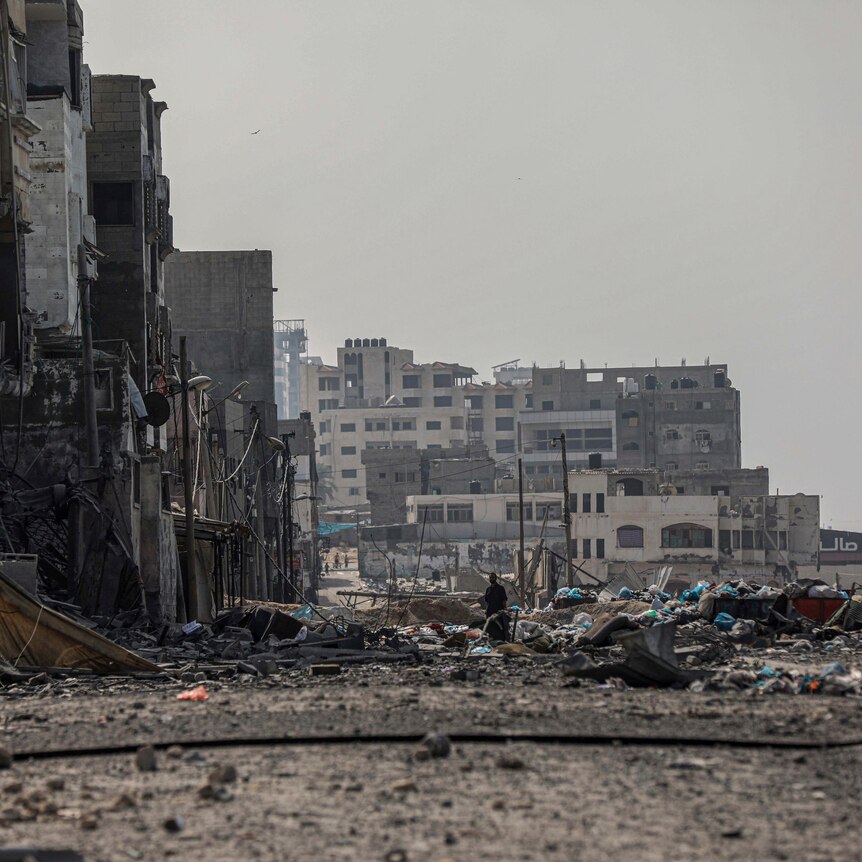 Rubble and collapsed buildings on road in Gaza