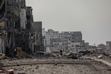 Rubble and collapsed buildings on road in Gaza