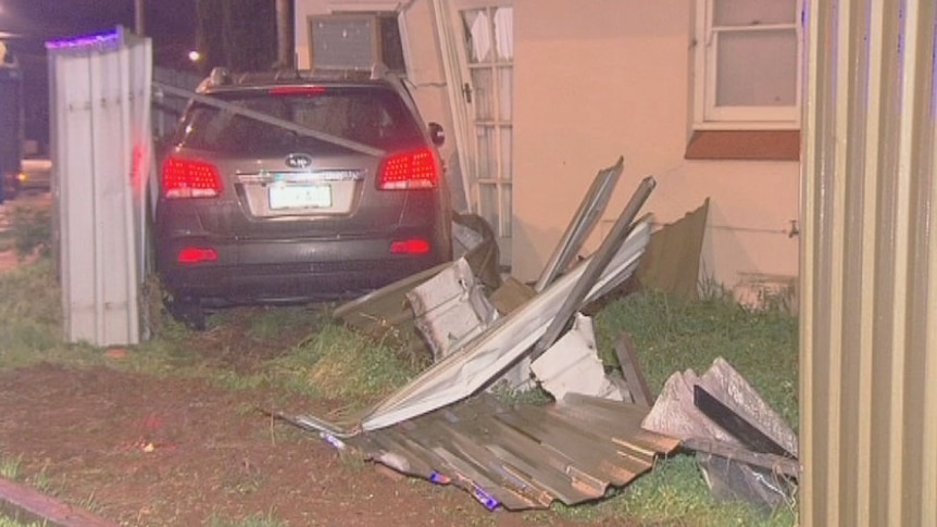 Car went through fence and into a house at Salisbury