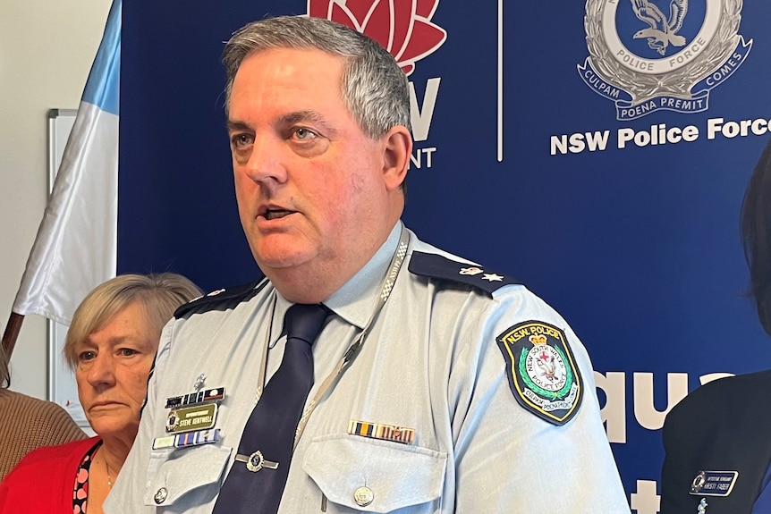 A police man at a press conference.