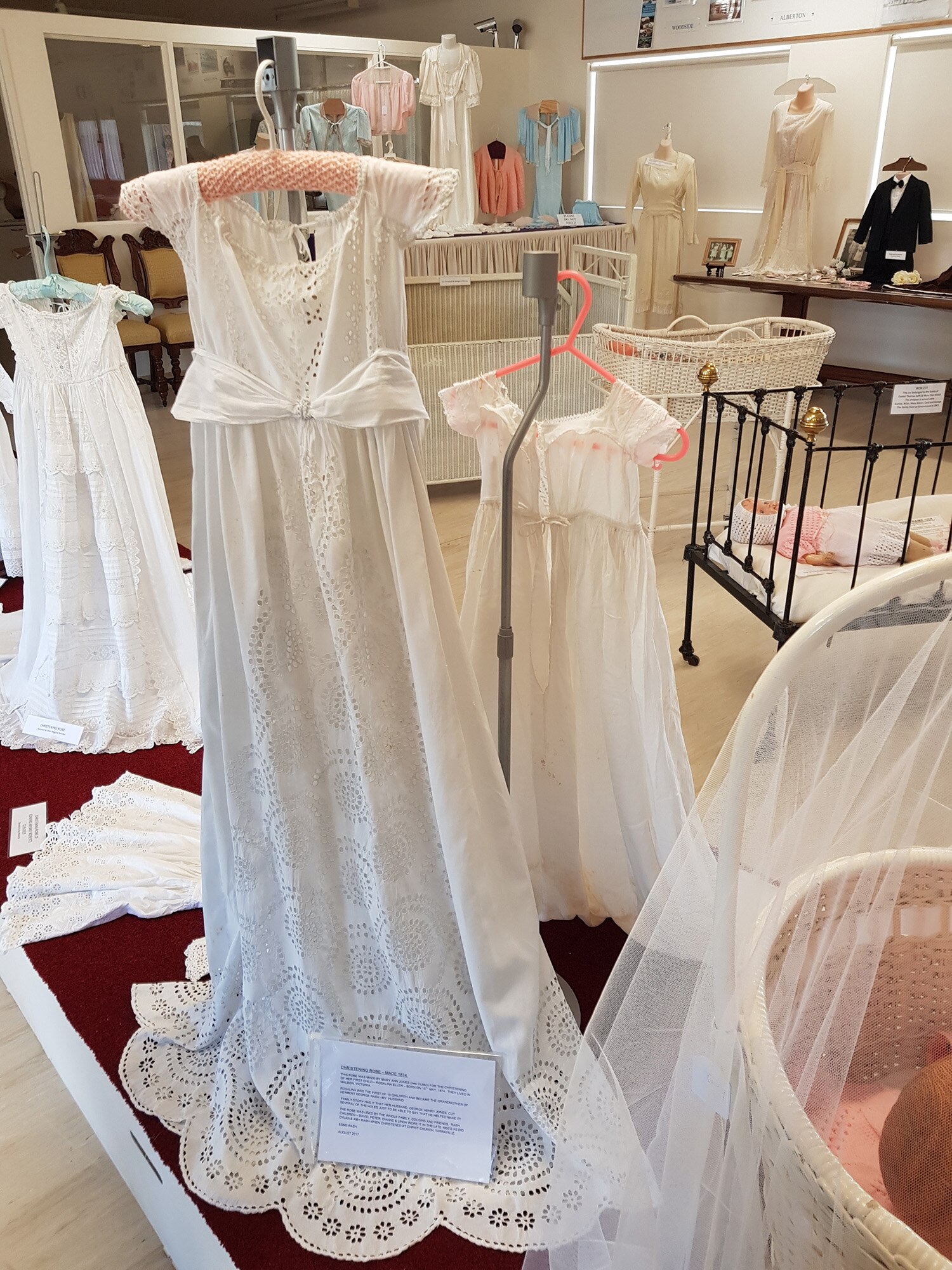 a display of white nighties and christening gowns 