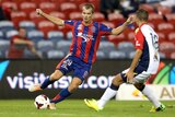 Newcastle's Joel Griffiths controls the ball against Adelaide.