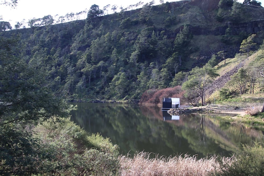 Sauna building on shore of a lake.