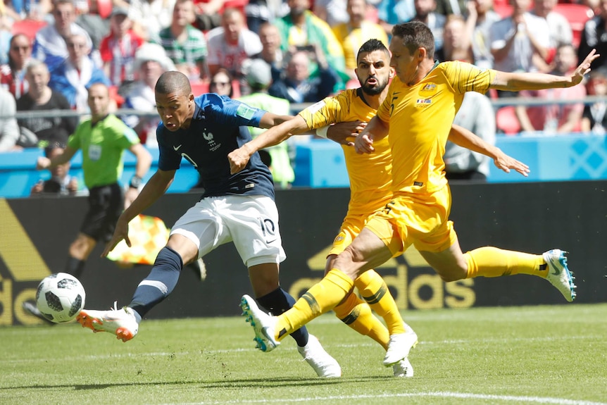 Kylian Mbappe takes a shot against the Socceroos