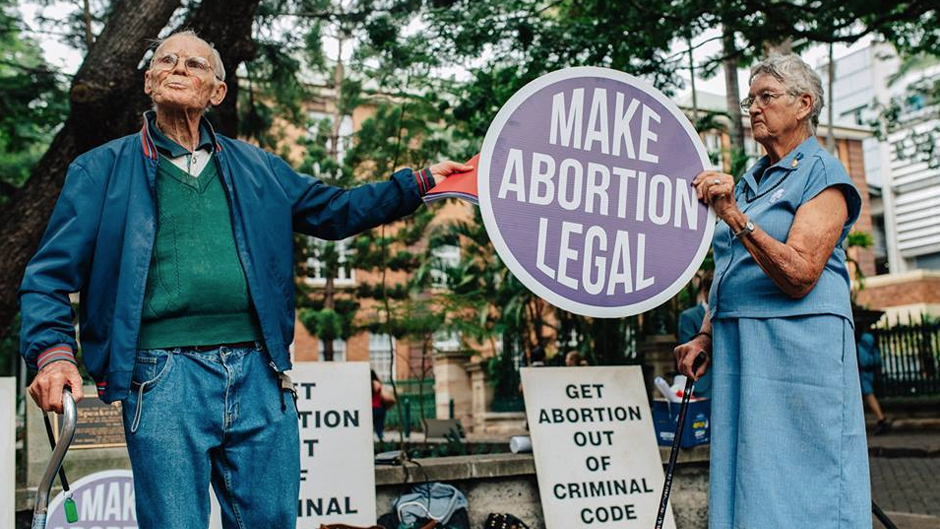 A couple attends a pro-choice rally in Brisbane in May, 2016.