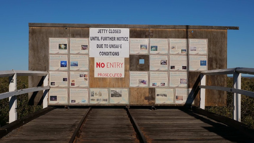 Wooden board with closure sign