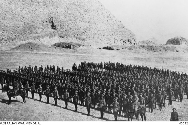 A black and white photo of members of the 3rd Battalion AIF assembled on parade in Egypt, 1914.