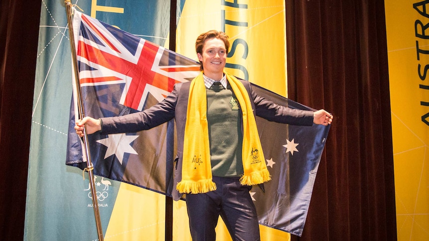 Snowboarder Scotty James poses with the Australian flag.