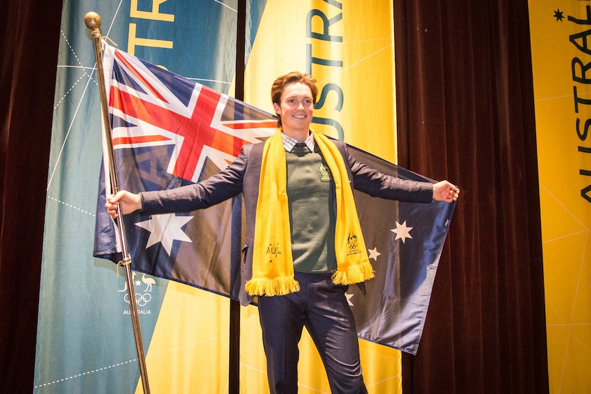 Snowboarder Scotty James poses with the Australian flag.