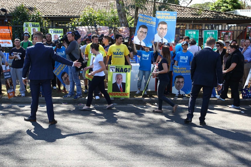 Campaigners from different parties gather on a street