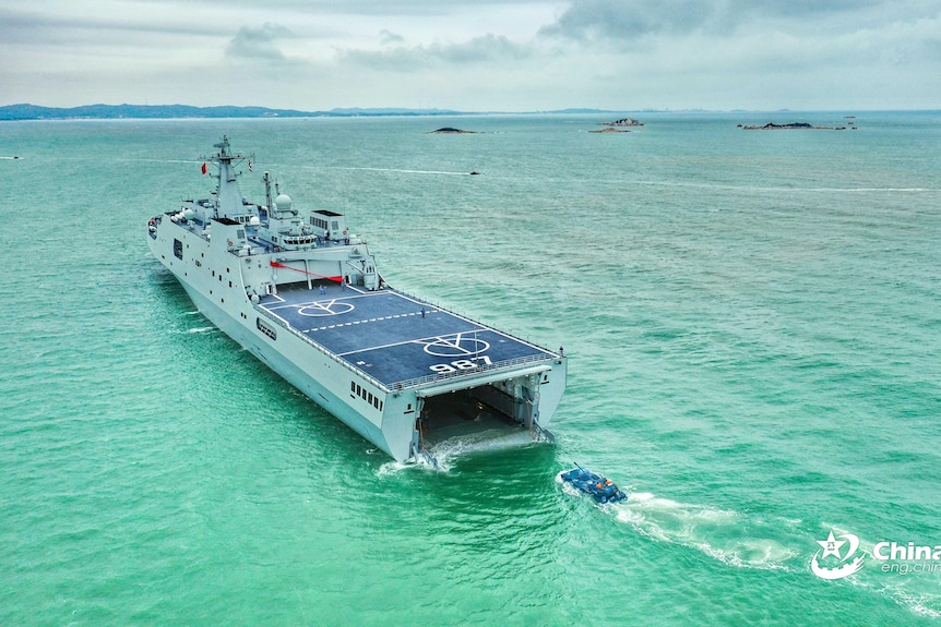 Ship glides along in water