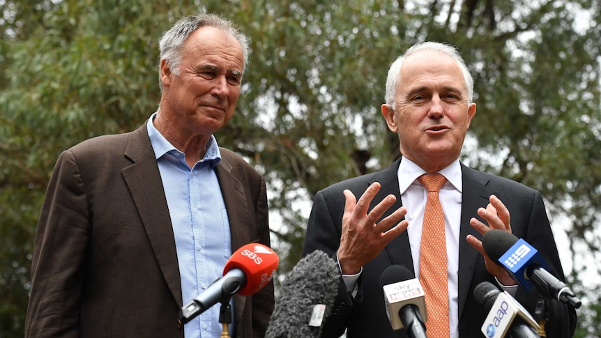 Malcolm Turnbull speaks at a press conference while Liberal Bennelong candidate John Alexander watches on.