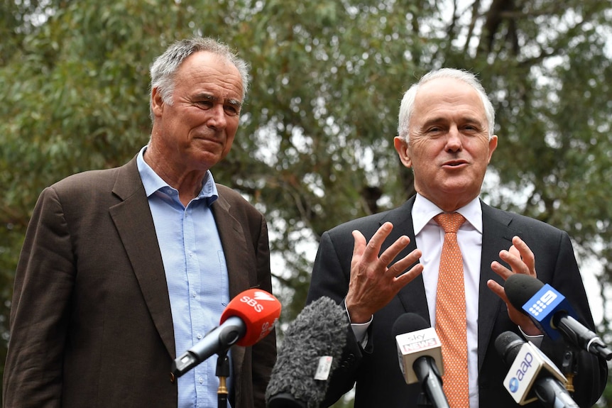 Malcolm Turnbull speaks at a press conference while Liberal Bennelong candidate John Alexander watches on.