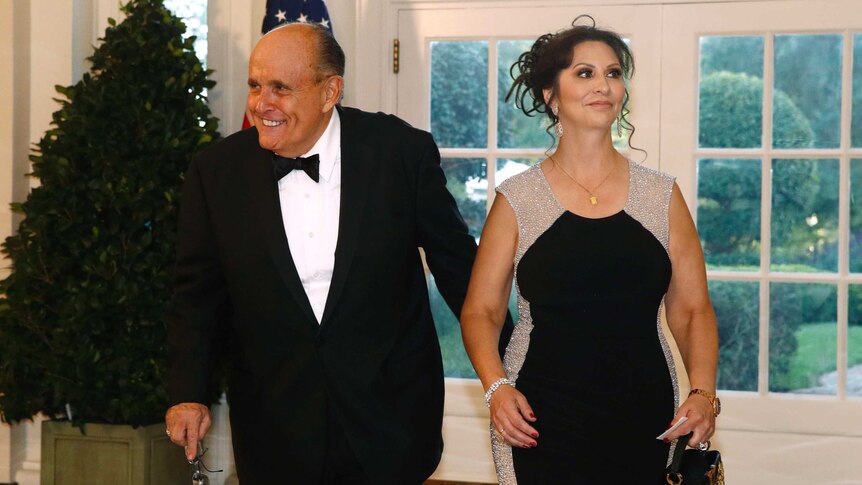 Rudy Giuliani and Maria Ryan arrive in formal attire for a state dinner at the White House.