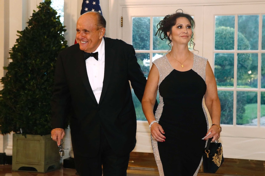 Rudy Giuliani and Maria Ryan arrive in formal attire for a state dinner at the White House.