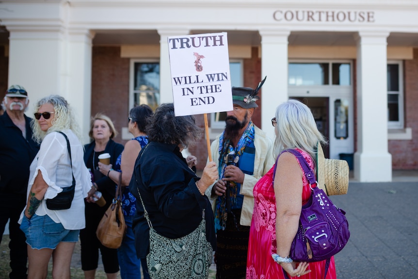 Supporters of a man charged with incitement gather outside the Geraldton Court.