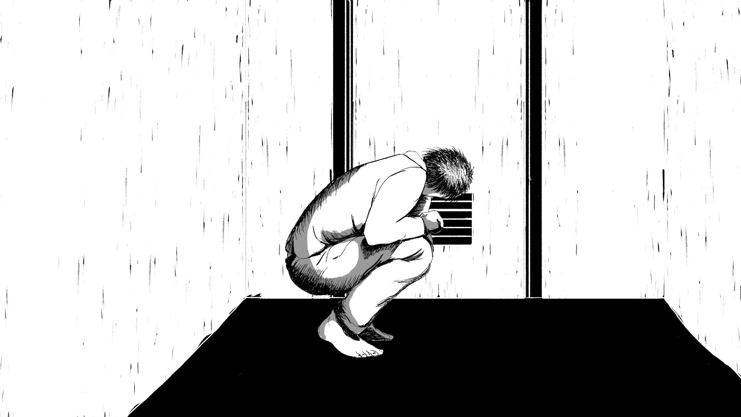 A man crouches down to speak through a door vent.