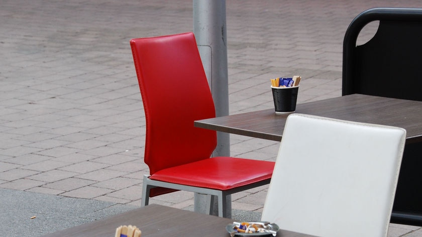 Ashtray on a cafe table in an outdoor eating area