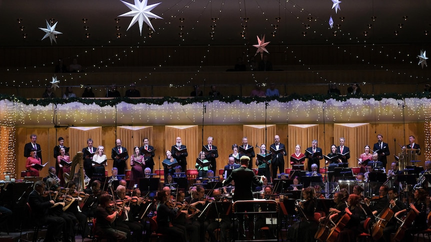 The Swedish Radio Choir and Orchestra with conductor Olof Boman, perfoming at their Christmas Concert at the Berwaldhallen, Stockholm 2021.