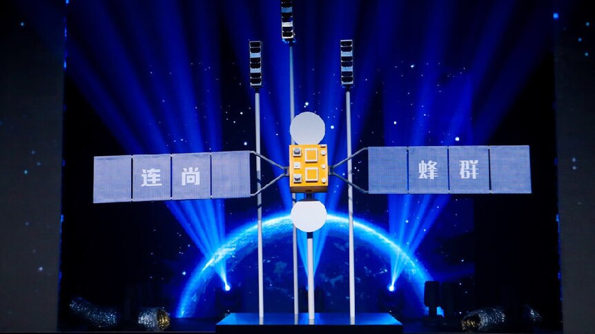 LinkSure Satellite No 1 sits on a stage