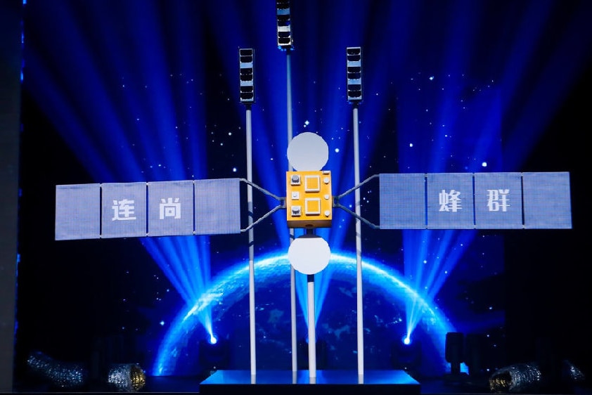 LinkSure Satellite No 1 sits on a stage