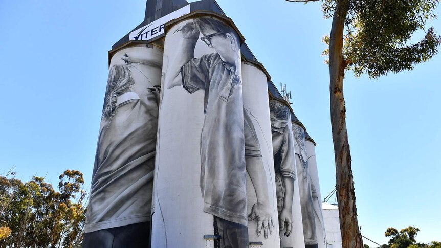 The grain silos at Coonalpyn featuring  images of children.