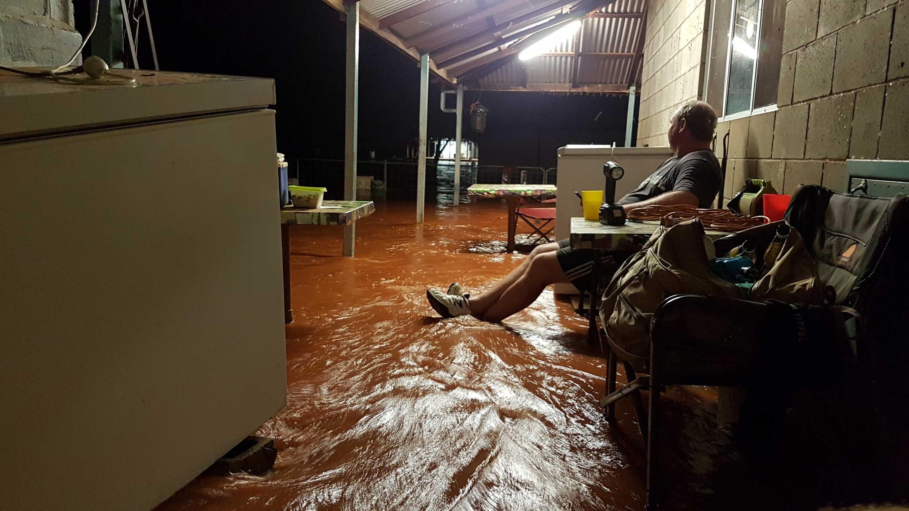 man on flooded porch