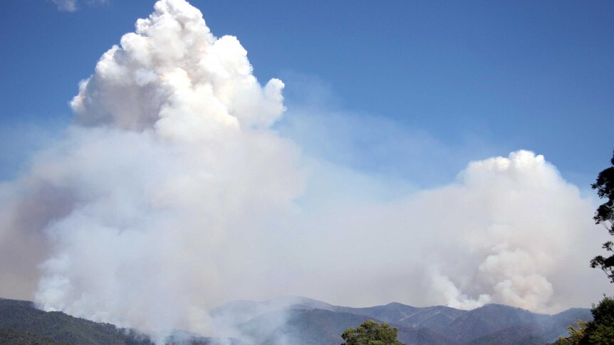 Smoke rises from a bushfire burning on Mt Feathertop.