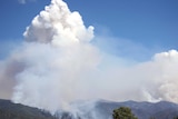 Smoke rises from a bushfire burning on Mt Feathertop.