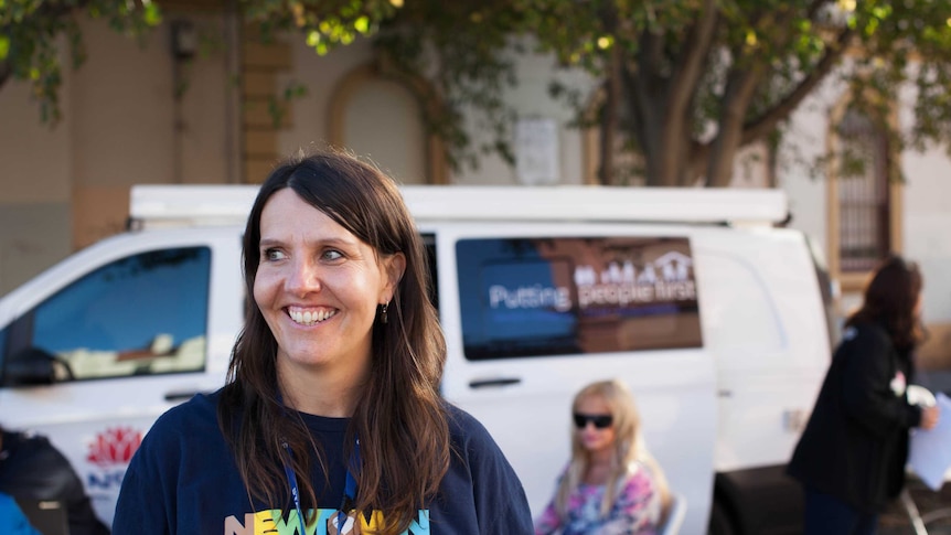 Elaine Macnish stands in front of a van in Newton