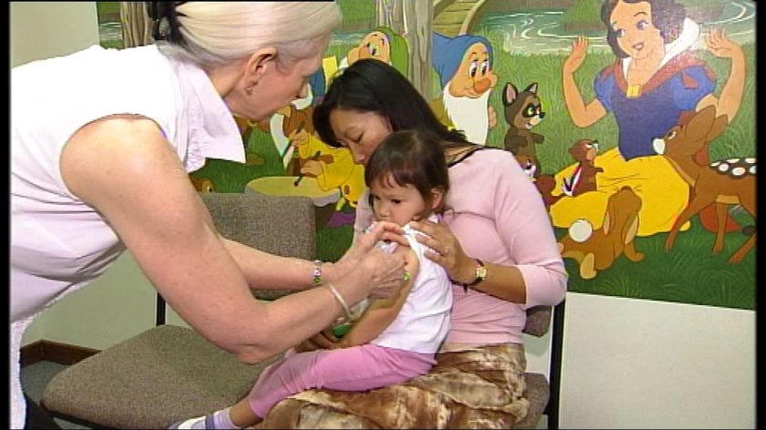 A child receives a vaccination against the flu.