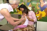 A child receives a vaccination against the flu.