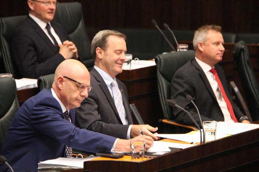 Tasmanian Ministers Peter Gutwein (front left), Michael Ferguson, Jeremy Rockliff and Roger Jaensch (rear) in Parliament.