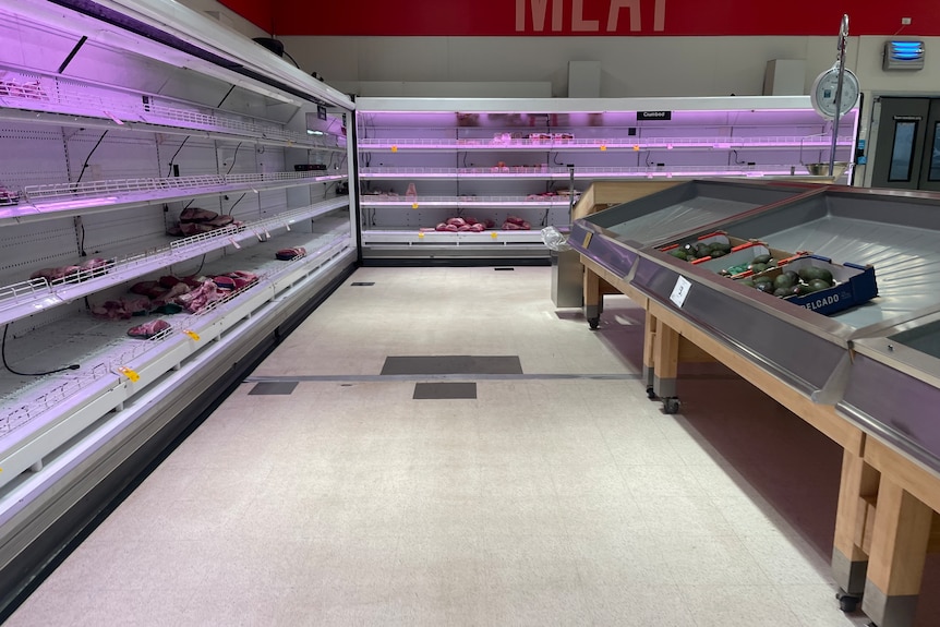 Empty shelves at a meat section of a supermarket
