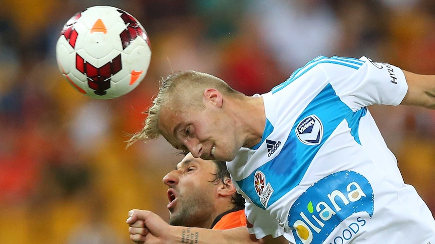 James Jeggo contests a headers with Thomas Broich