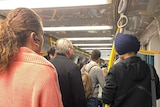 People standing inside a train